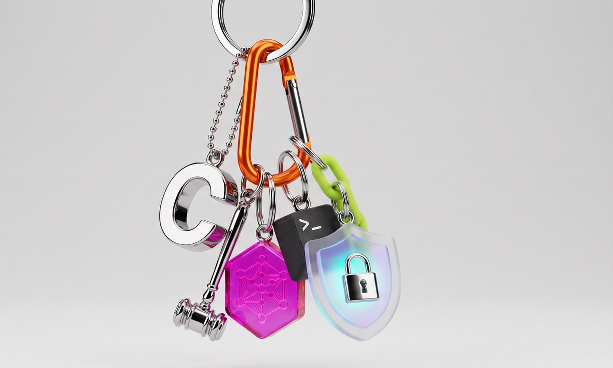 Chrome keychain with a letter C, a gavel, a node token, a terminal keycap, a chain link and a glass security shield